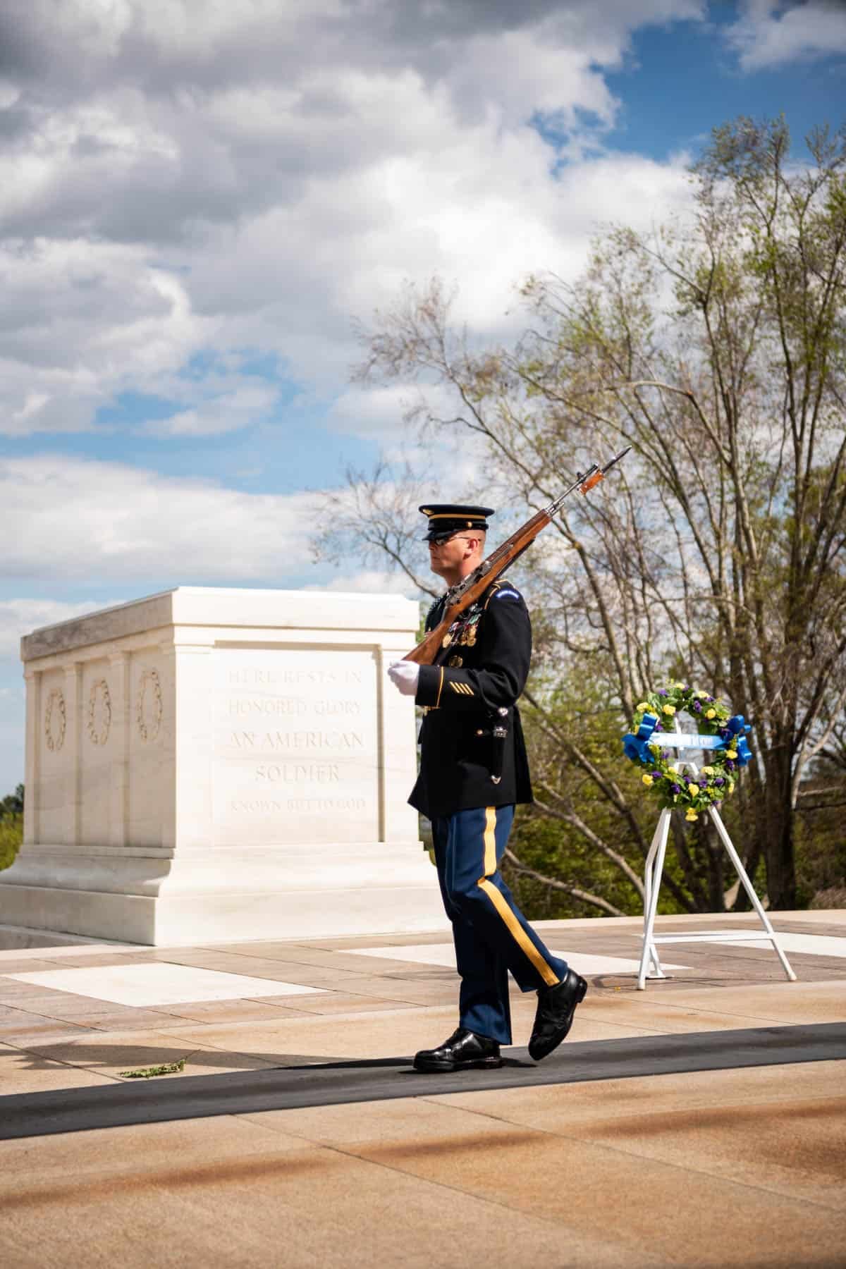 A soldier guarding the tomb of the unknown soldier at Arlington National Cemetery.