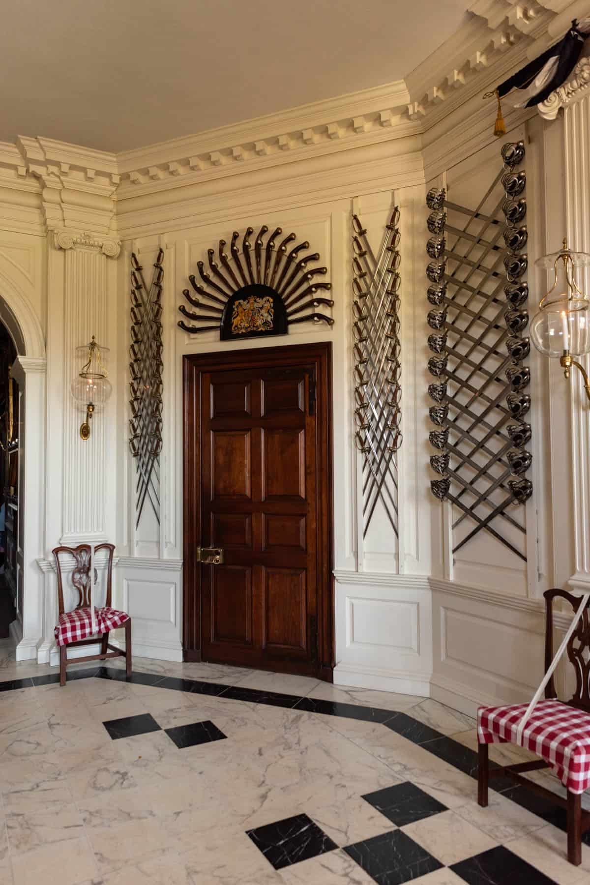 Crossed sabers decorating the wall in the entryway of the Governor's Mansion in Colonial Williamsburg.