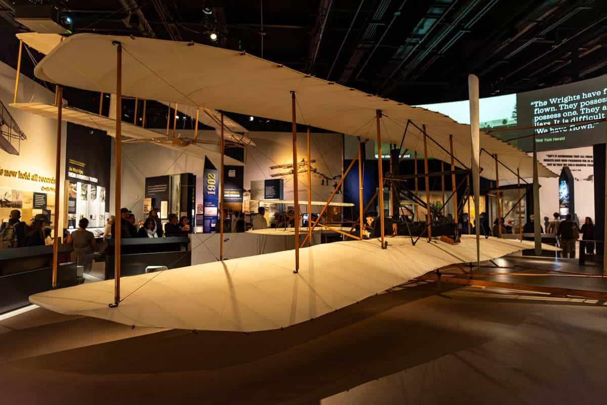 An image of the Wright Brothers' plane in the Air & Space Museum in Washington D.C.