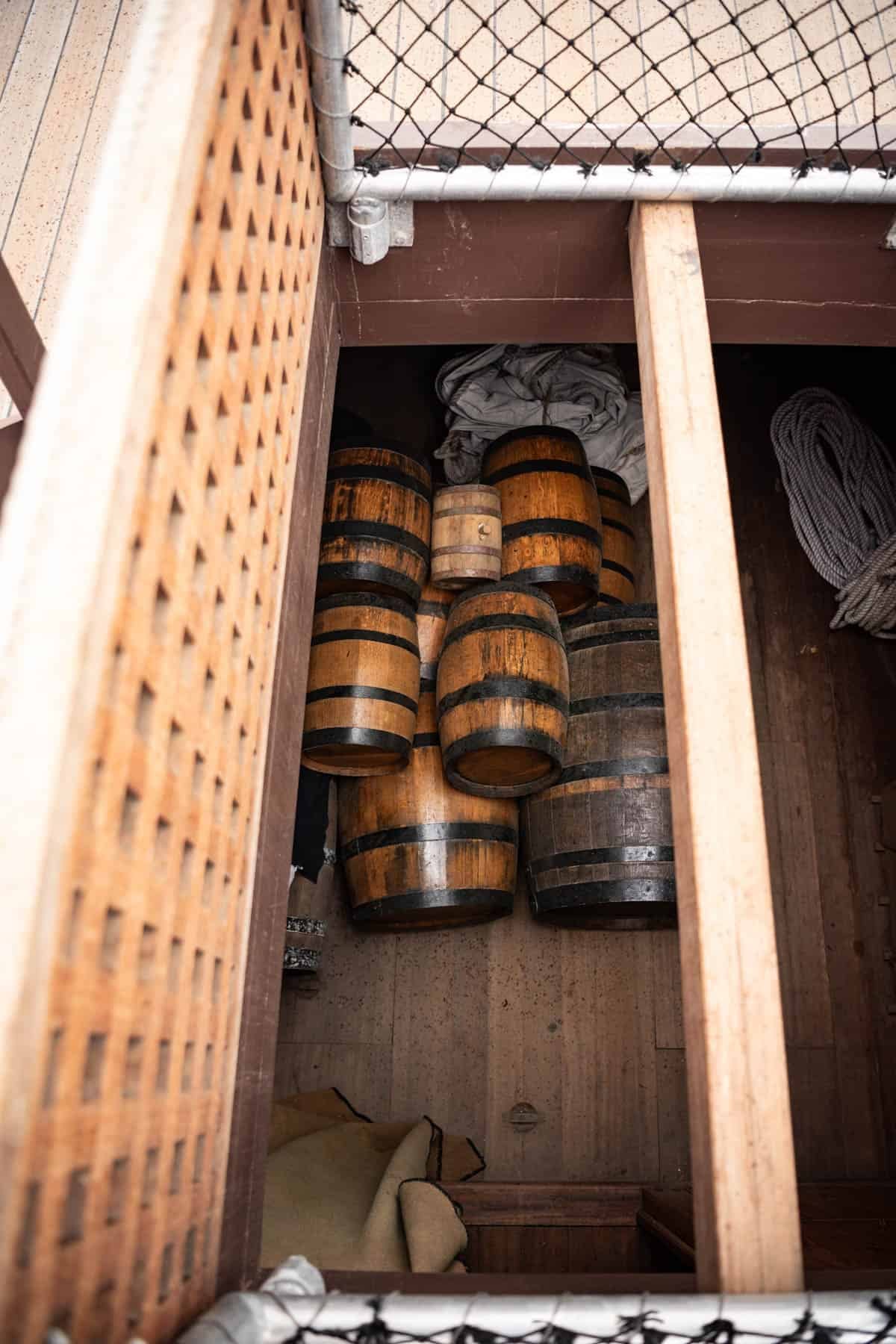 An image of kegs in the hold of a replica sailing ship at Jamestown Settlement museum.