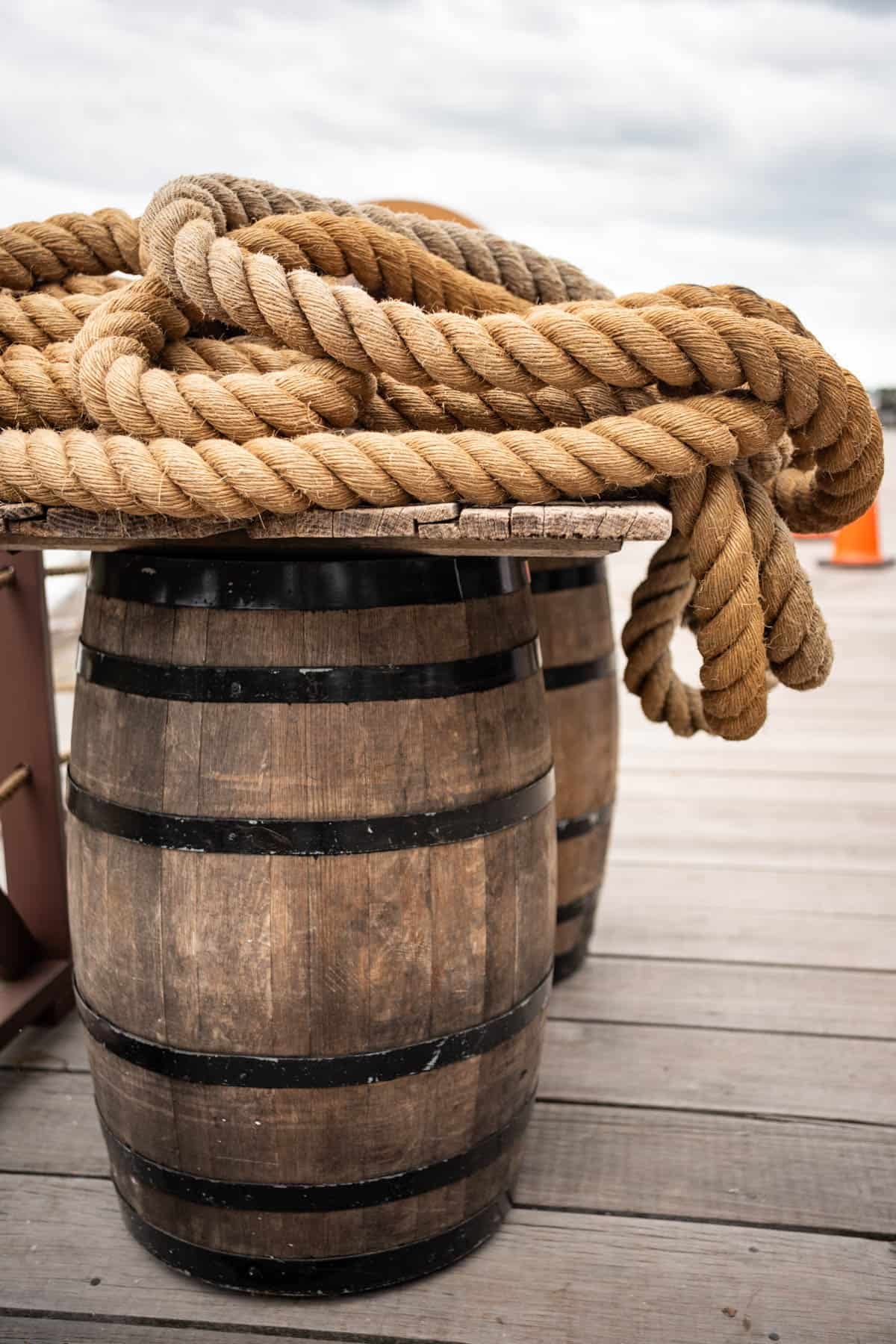 Large barrels with heavy rope laid on top.
