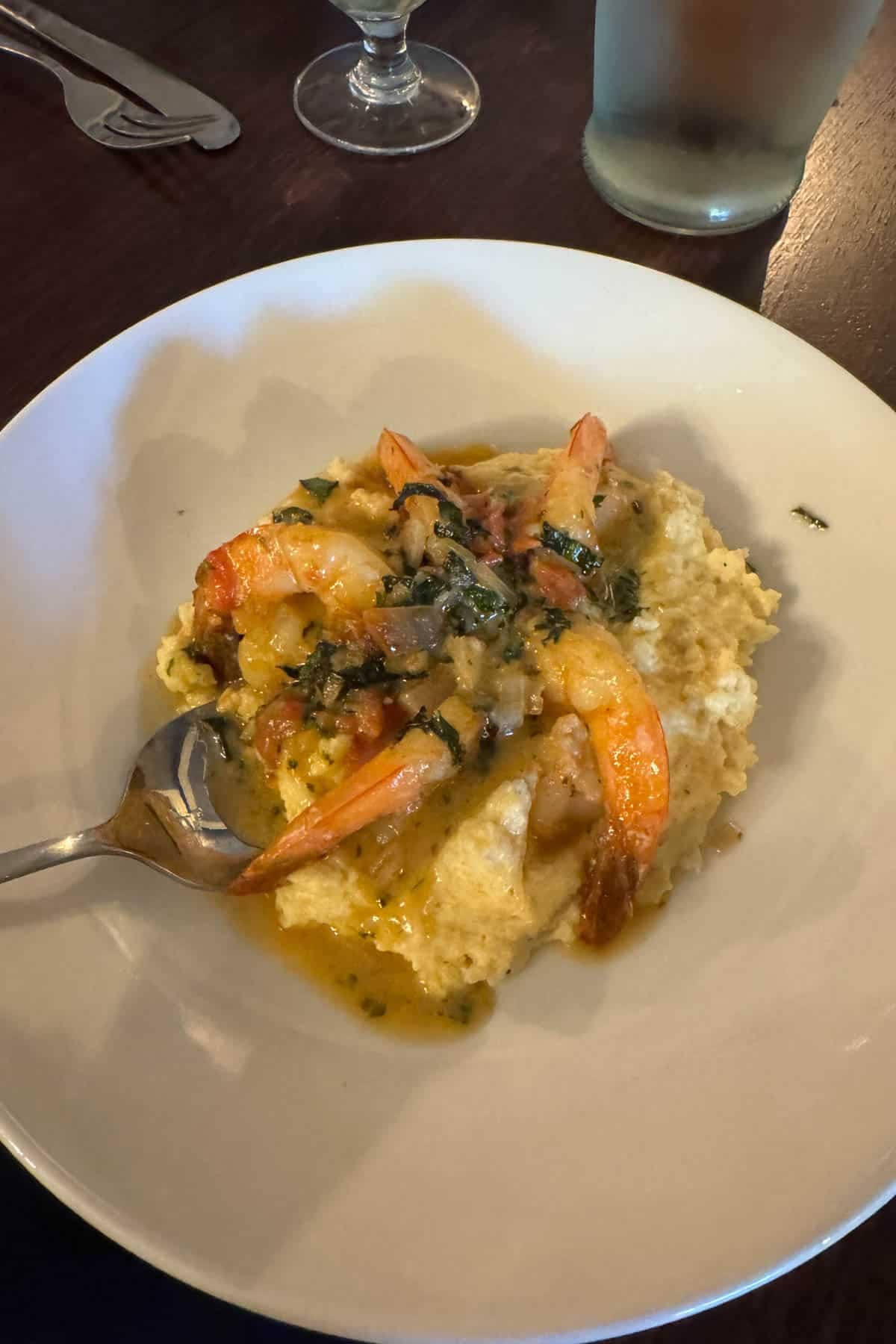 A bowl of shrimp and grits.