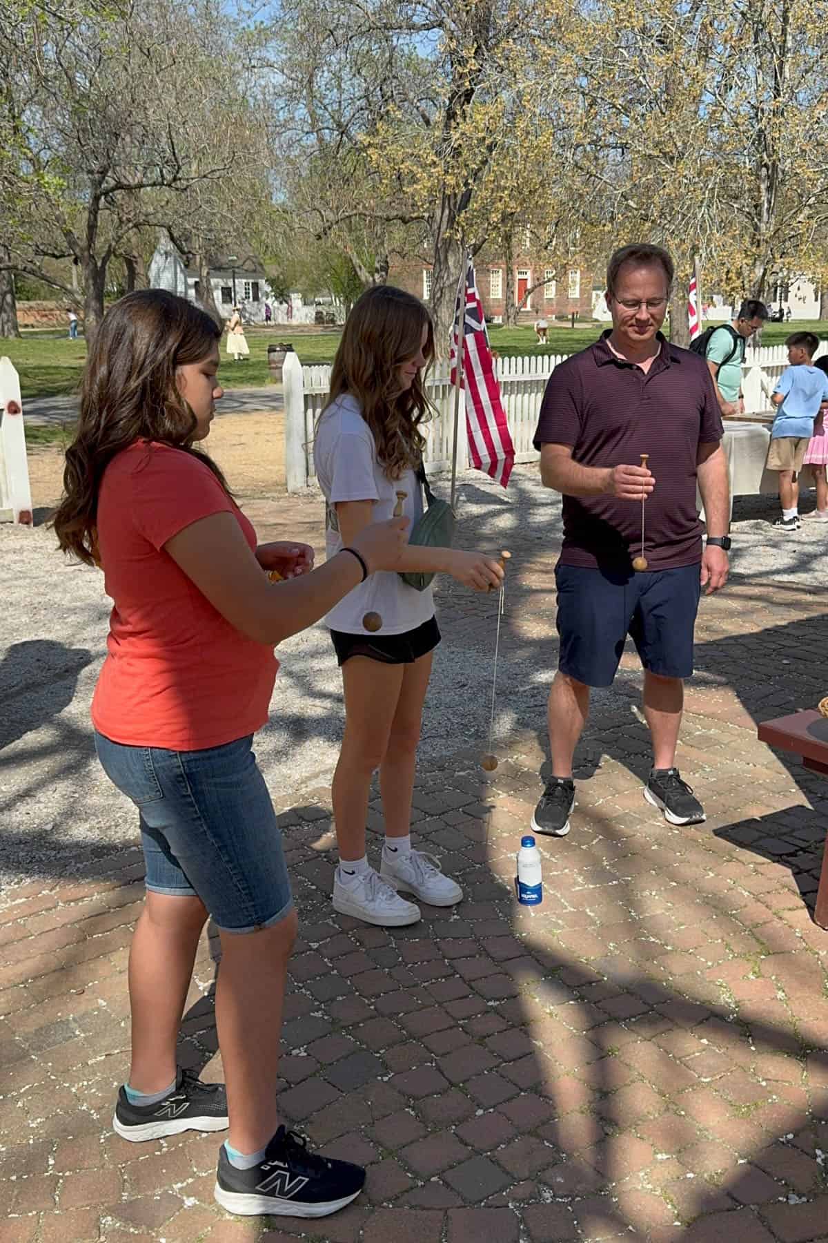 A family attempting to play a colonial game.