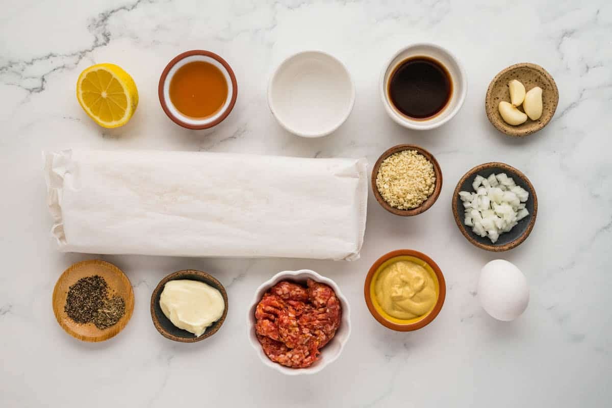Ingredients for making puff pastry sausage rolls.