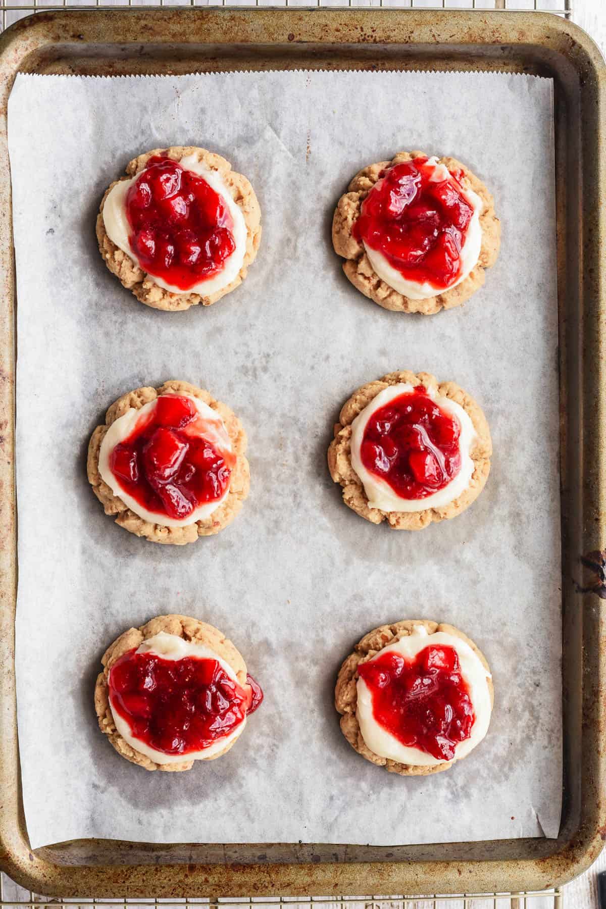 Adding a strawberry jam component to strawberry pretzel cookies.