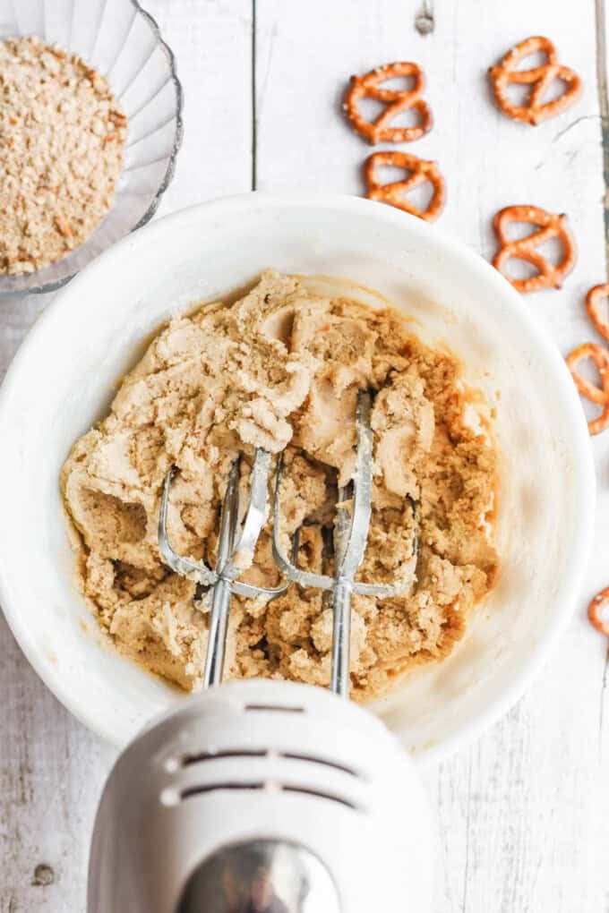 Mixing pretzel cookie dough.