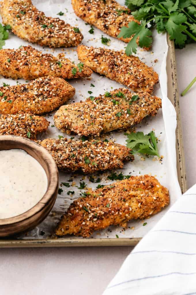 A side view of everything bagel baked chicken tenders.
