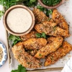 An image of everything bagel baked chicken tenders on a plate.