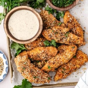 An image of everything bagel baked chicken tenders on a plate.