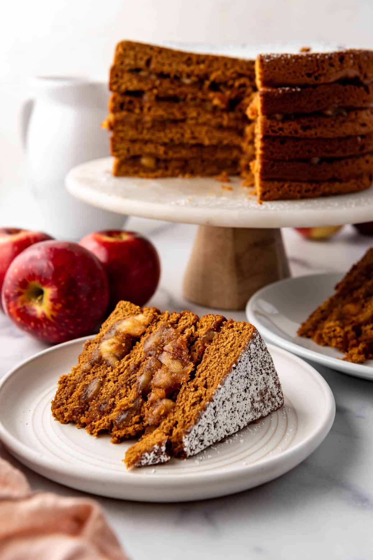 A slice of apple stack cake on a plate.