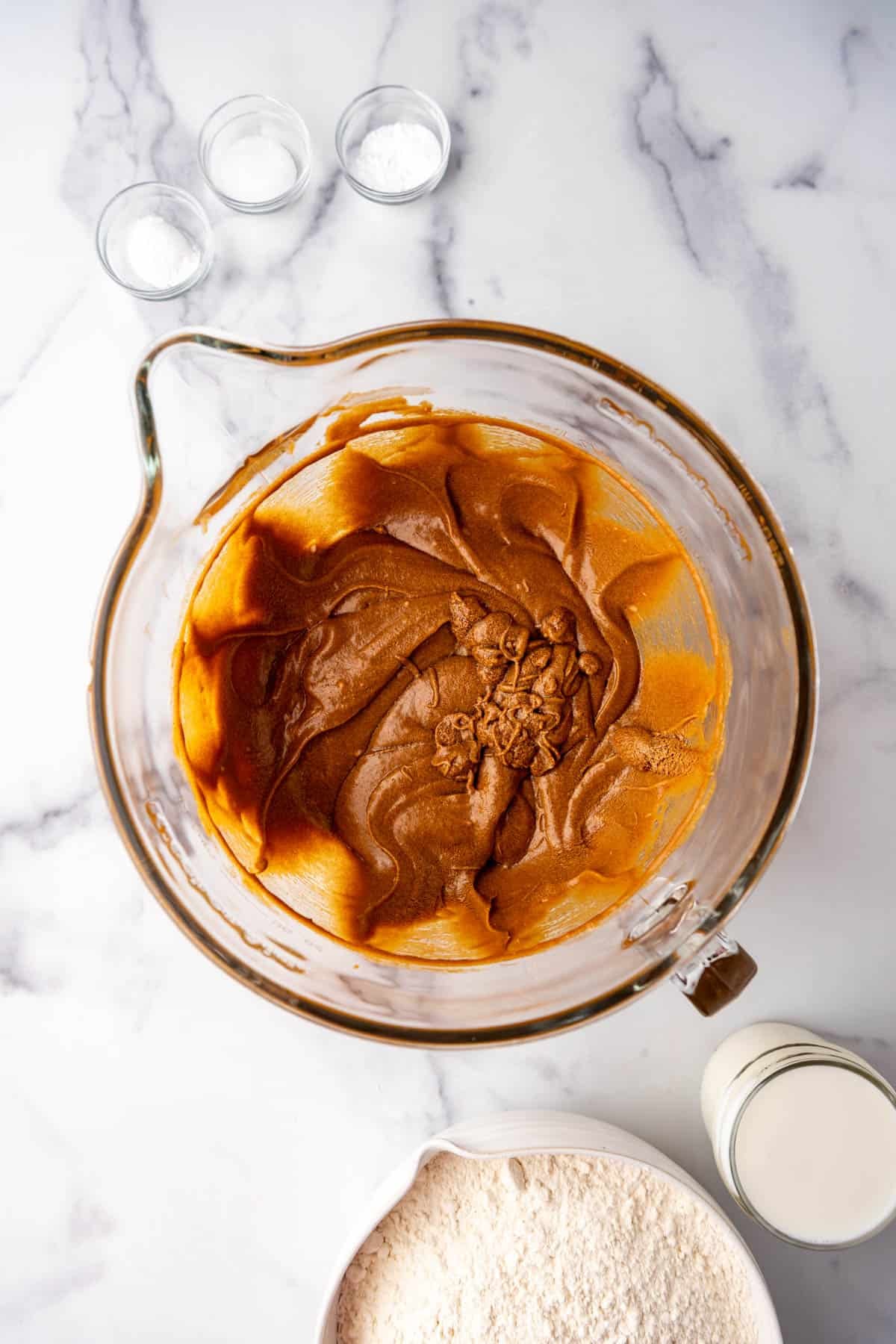 Molasses cake batter in a glass mixing bowl.