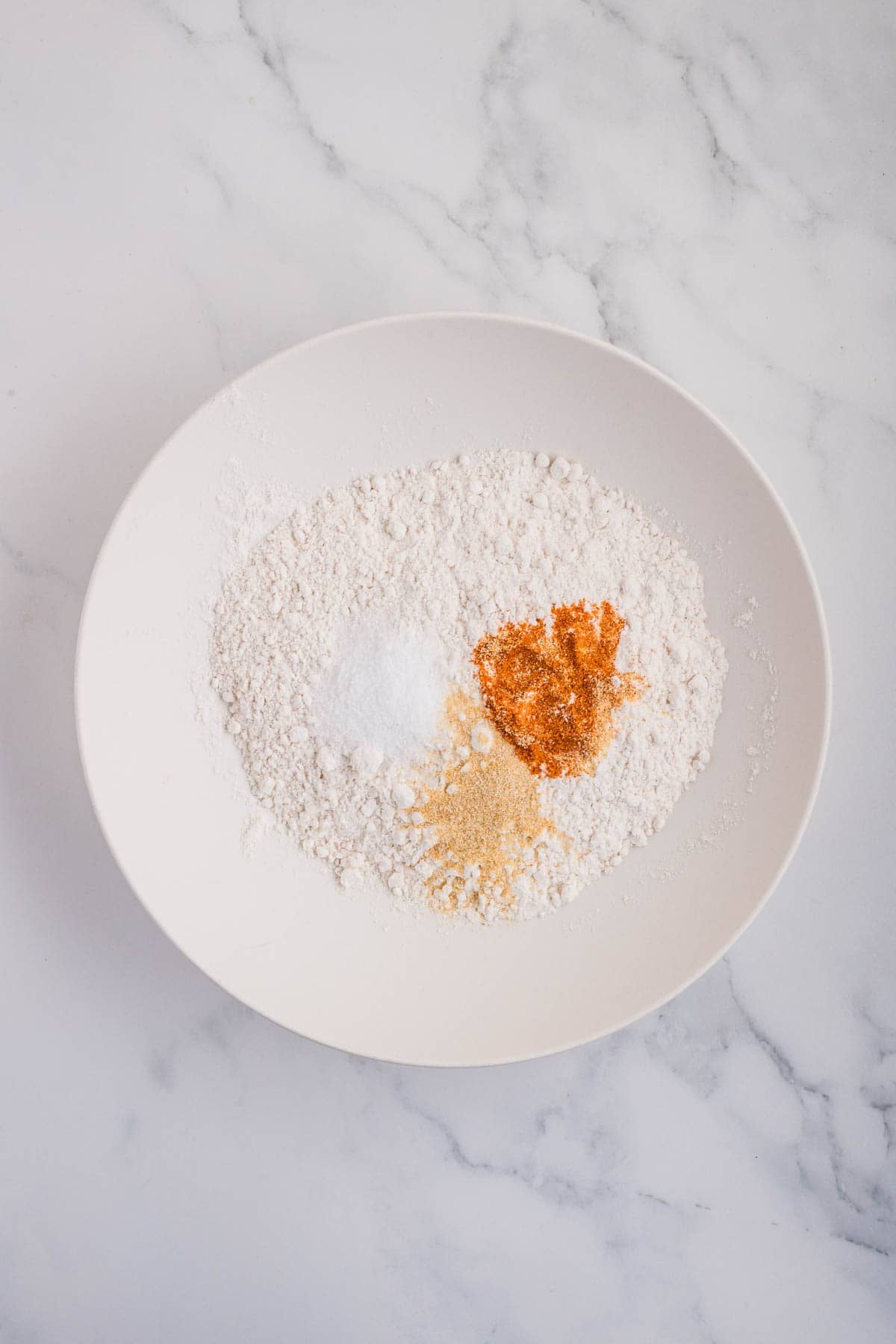 A dredging station of flour, salt, and seasonings.