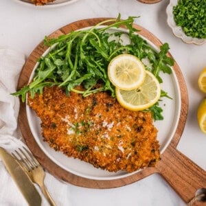 An overhead image of chicken milanese on a plate.