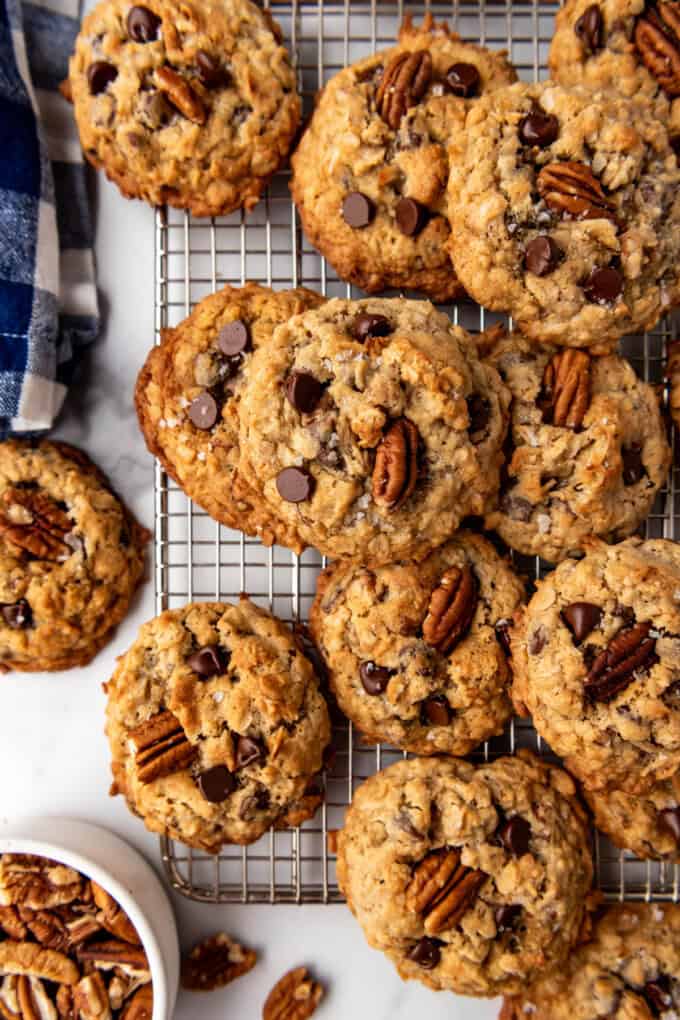 An overhead image of cowboy cookies on a wire rack.