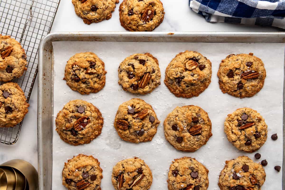 An overhead image of cowboy cookies on a baking sheet.