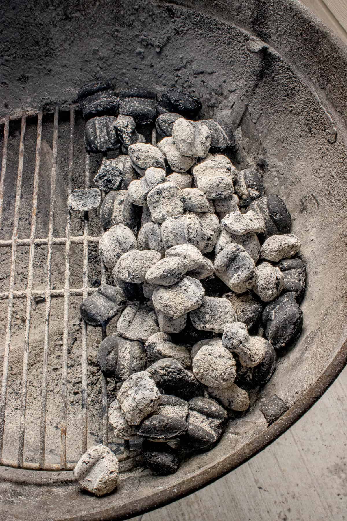 Charcoal set up for indirect heating on a grill.