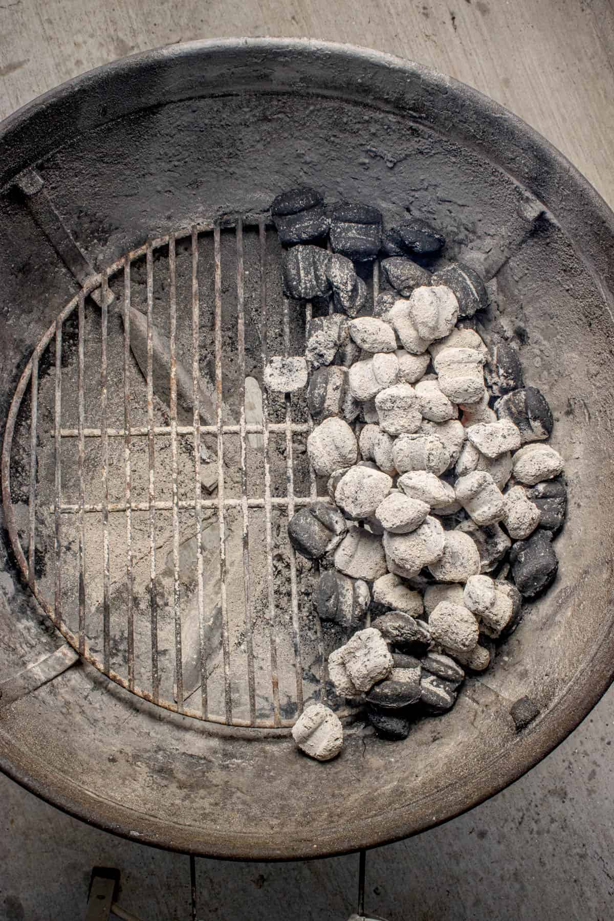 Charcoal set up for indirect heating on a grill.