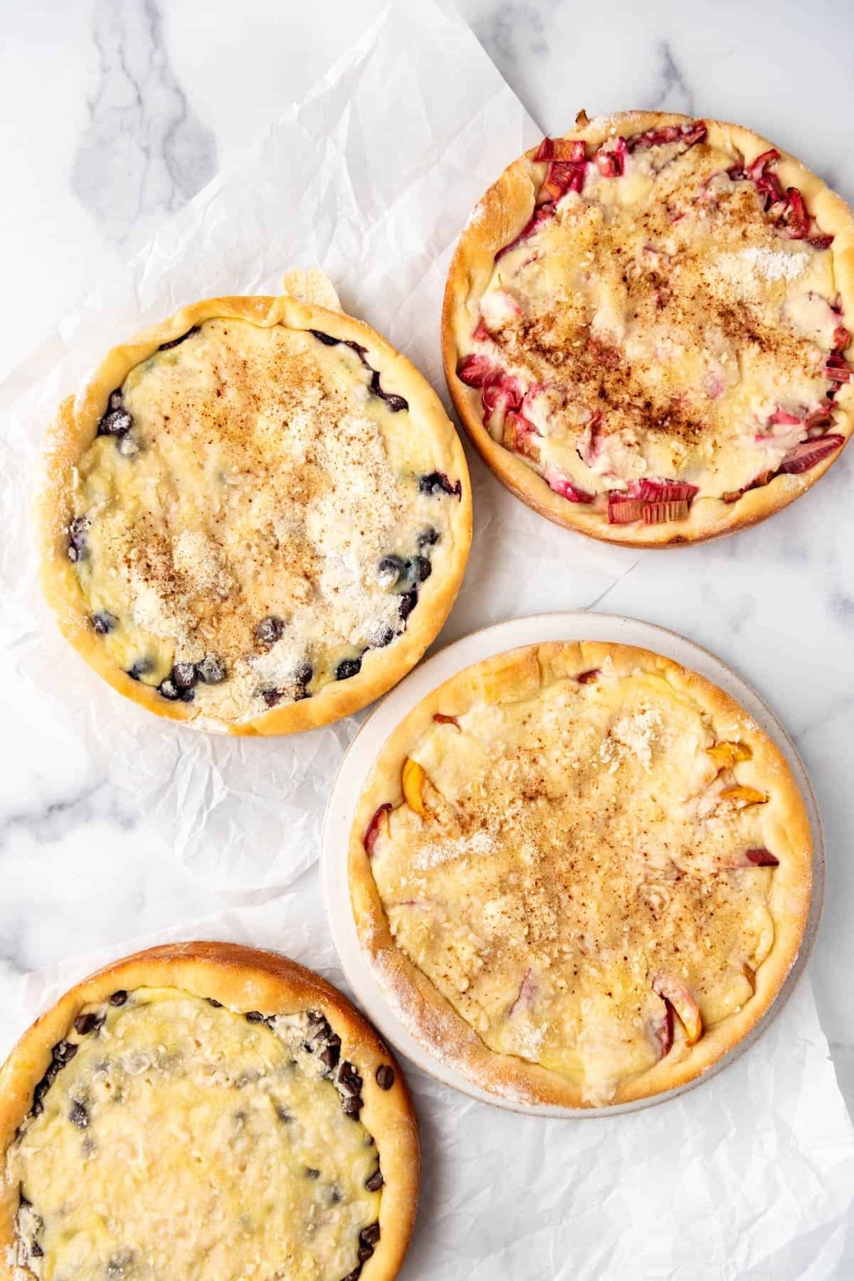 An overhead image of baked north dakota kuchen in different flavors.
