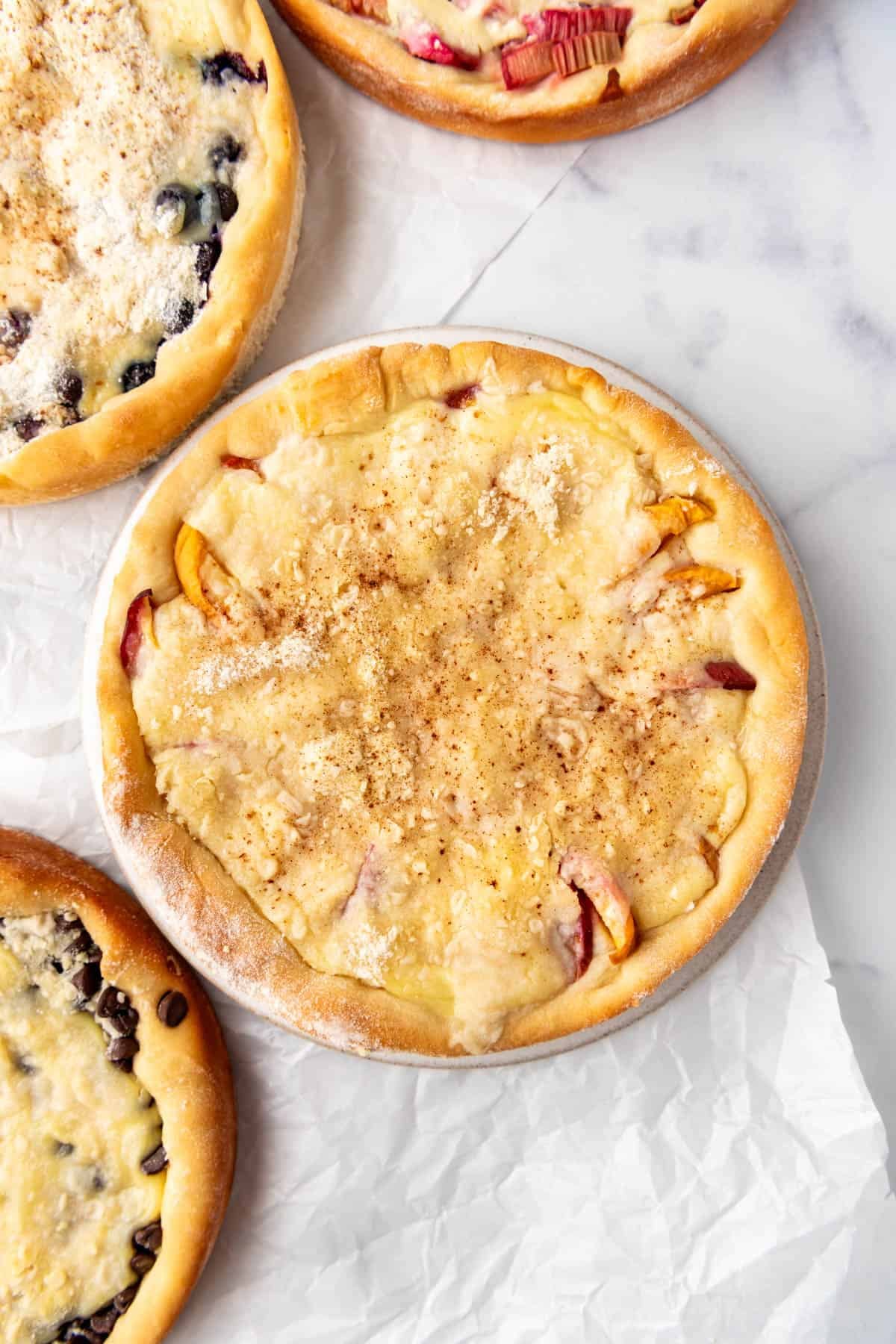 A close overhead image of a peach kuchen.