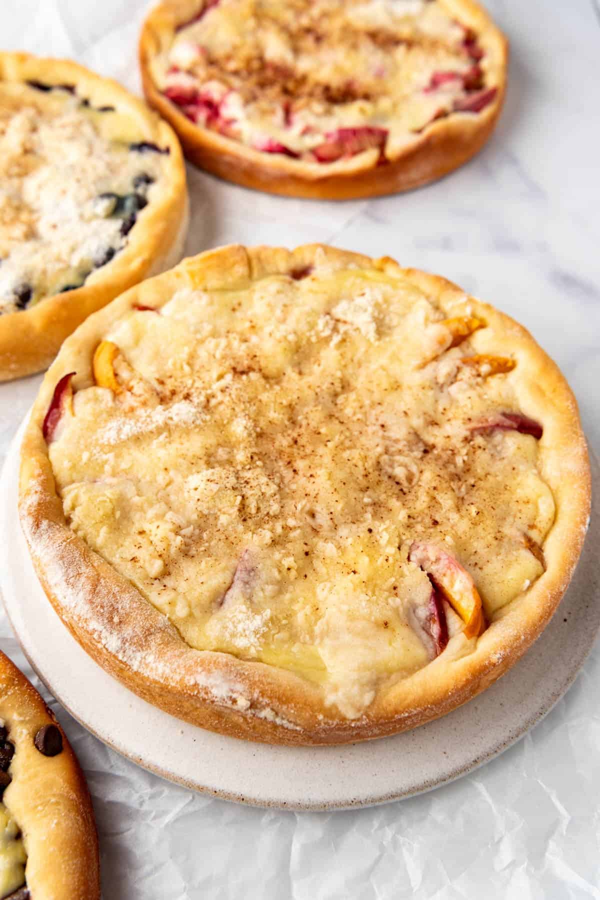 A close overhead image of a peach kuchen.