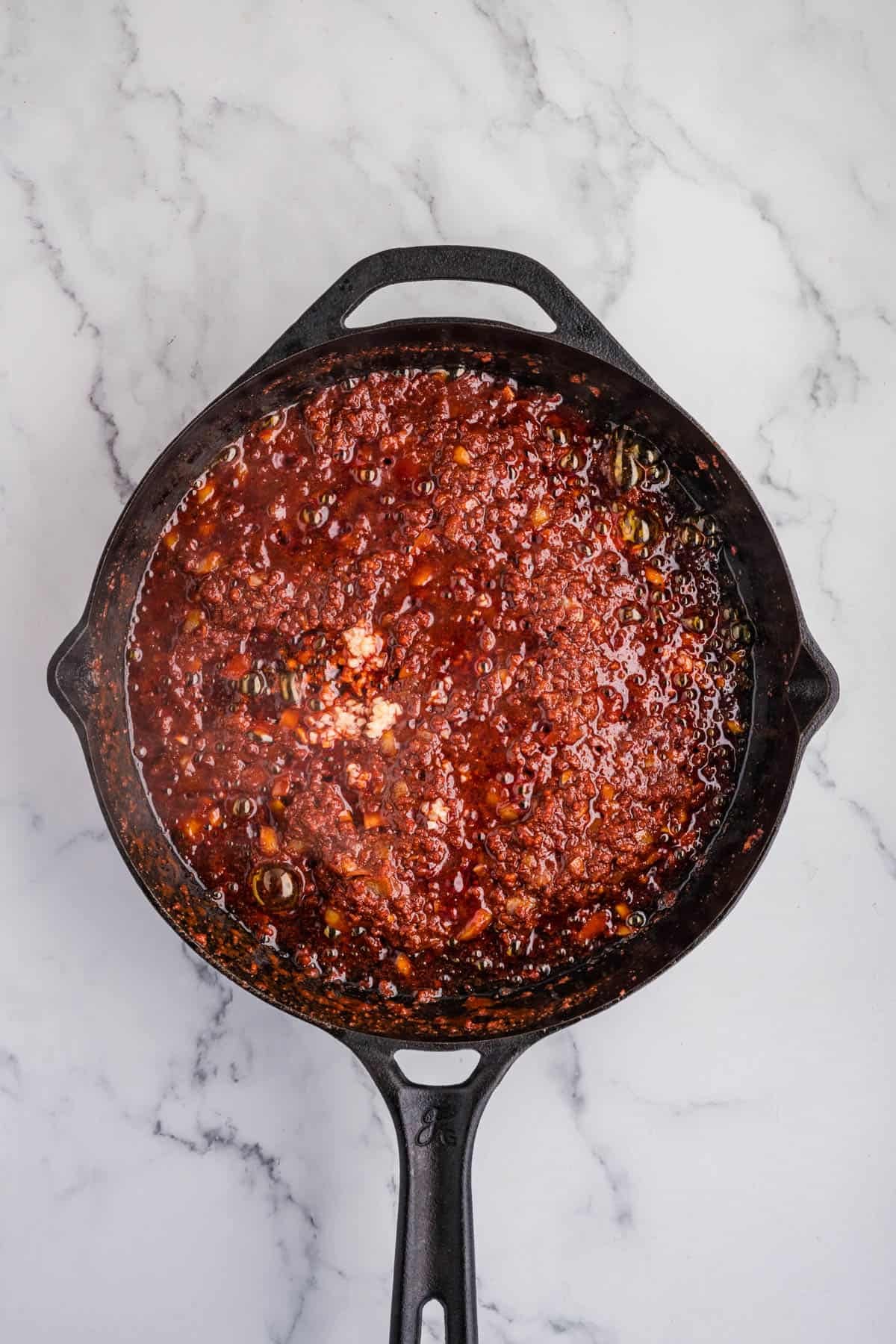 Cooked chorizo in a skillet.