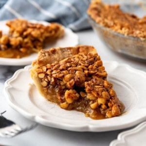 A slice of Virginia peanut pie on a white plate.