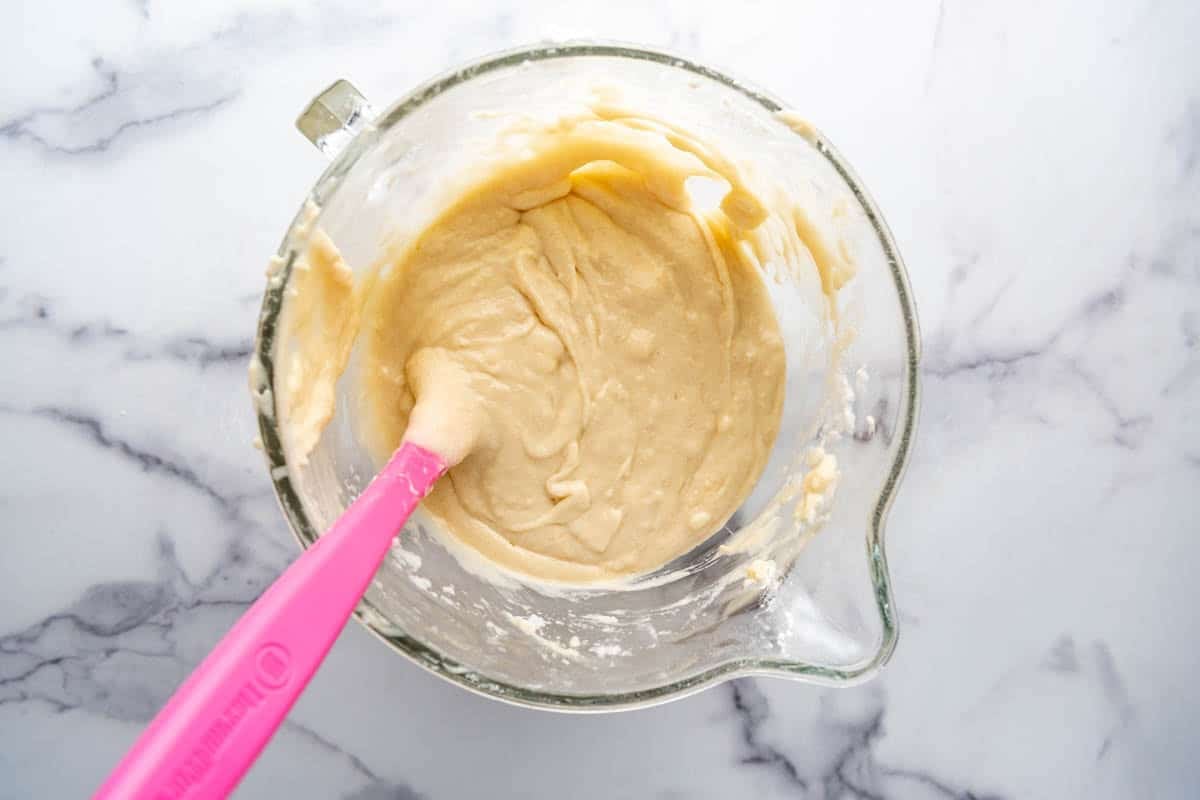 Finished cake batter in a glass mixing bowl.