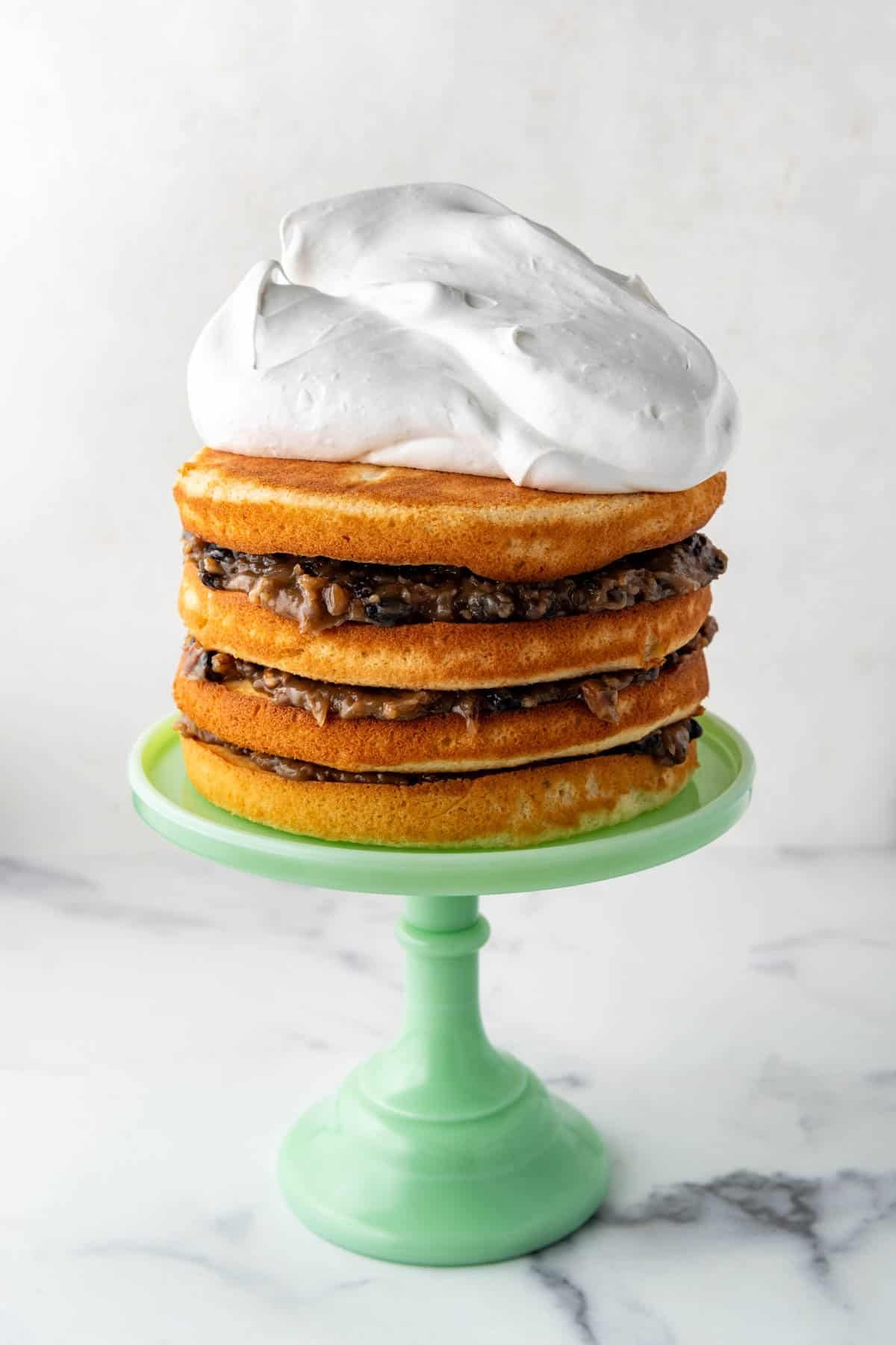 7-minute frosting piled on top of 4 layers of cake and filling.
