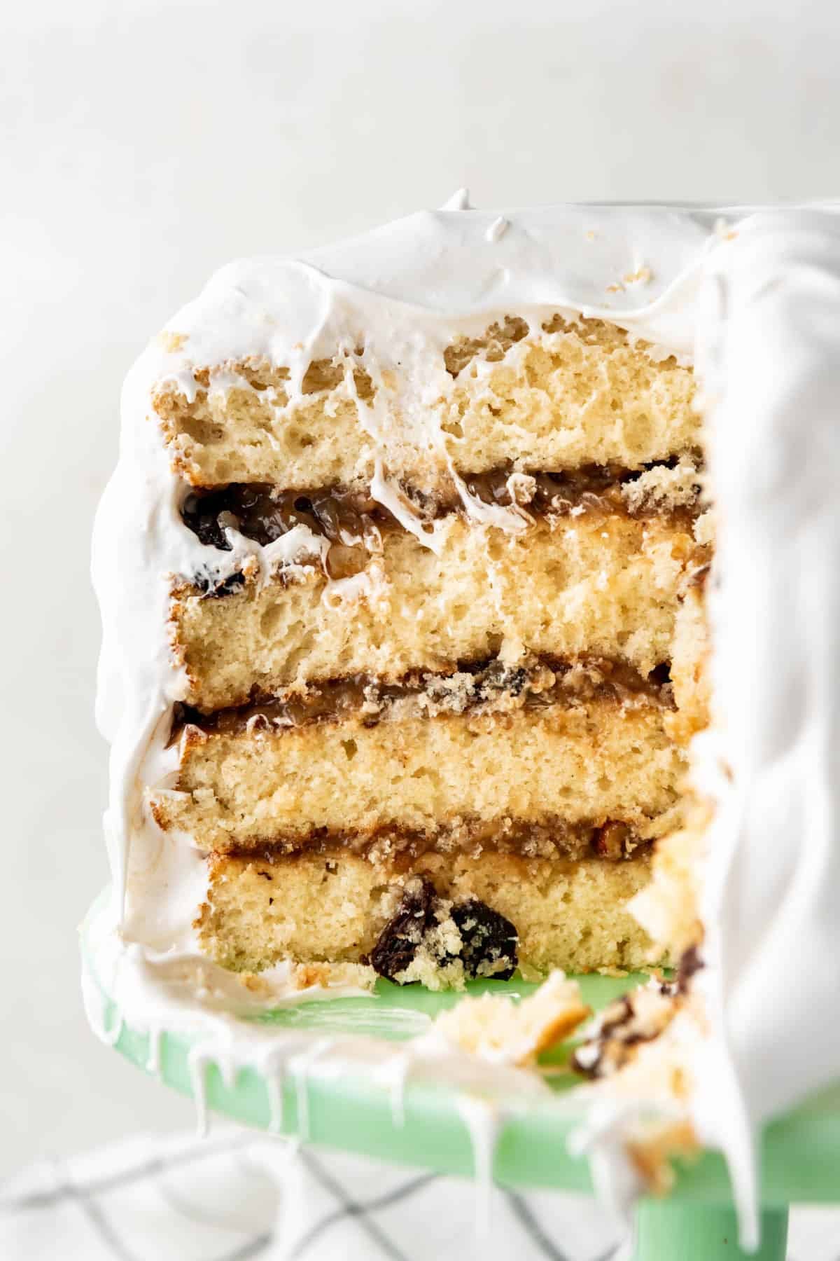 A close up image of the layers of a cross-section of Alabama Lane Cake.