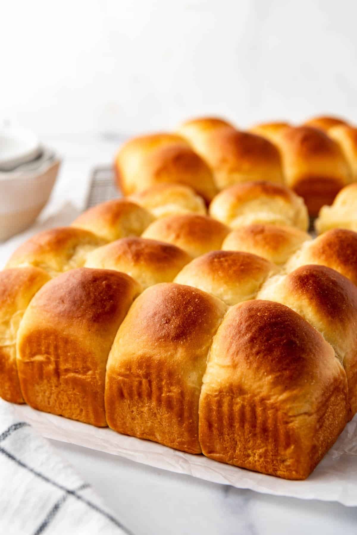 An image of golden brown homemade Hawaiian rolls.