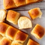 Homemade Hawaiian rolls with one of them turned on its side showing