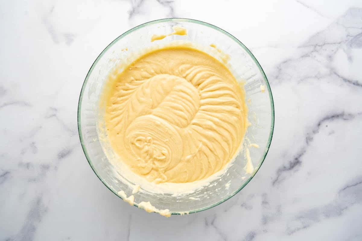 A bowl of yellow cake batter.
