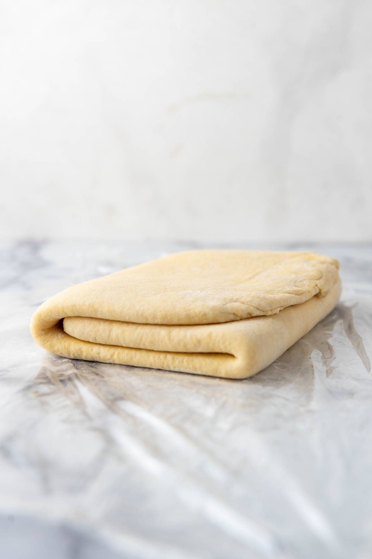 Fully laminated kringle pastry dough folded into thirds.