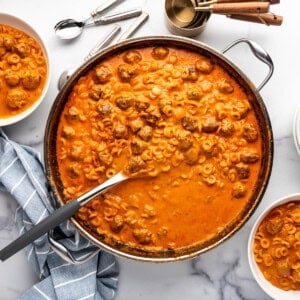 A pan of homemade spaghettios with meatballs.