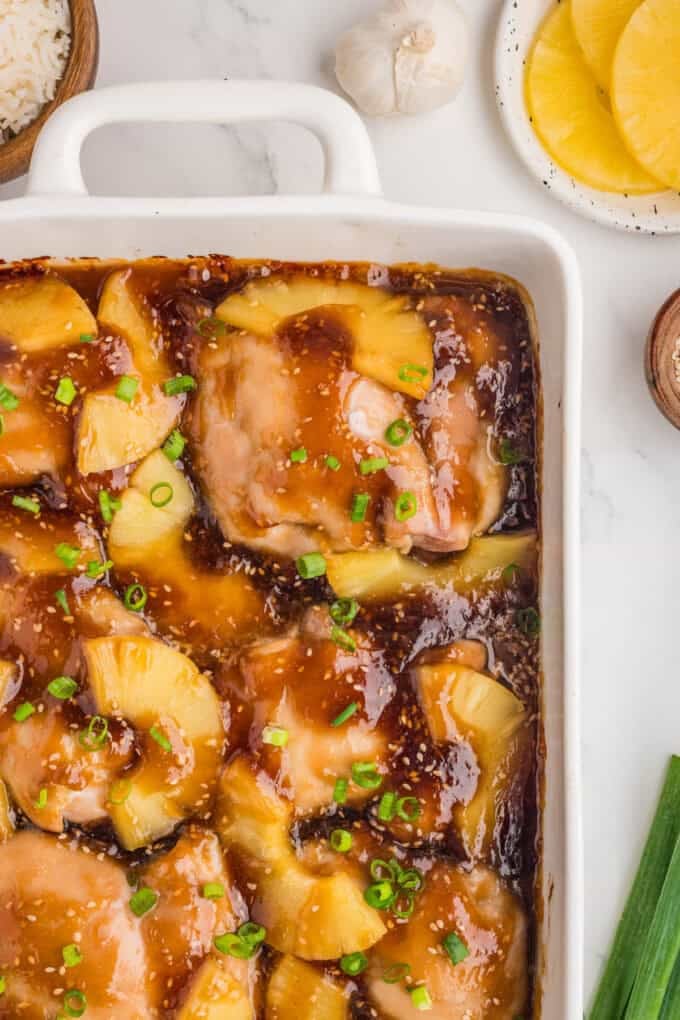 An overhead image of a pan of baked pineapple teriyaki chicken thighs.