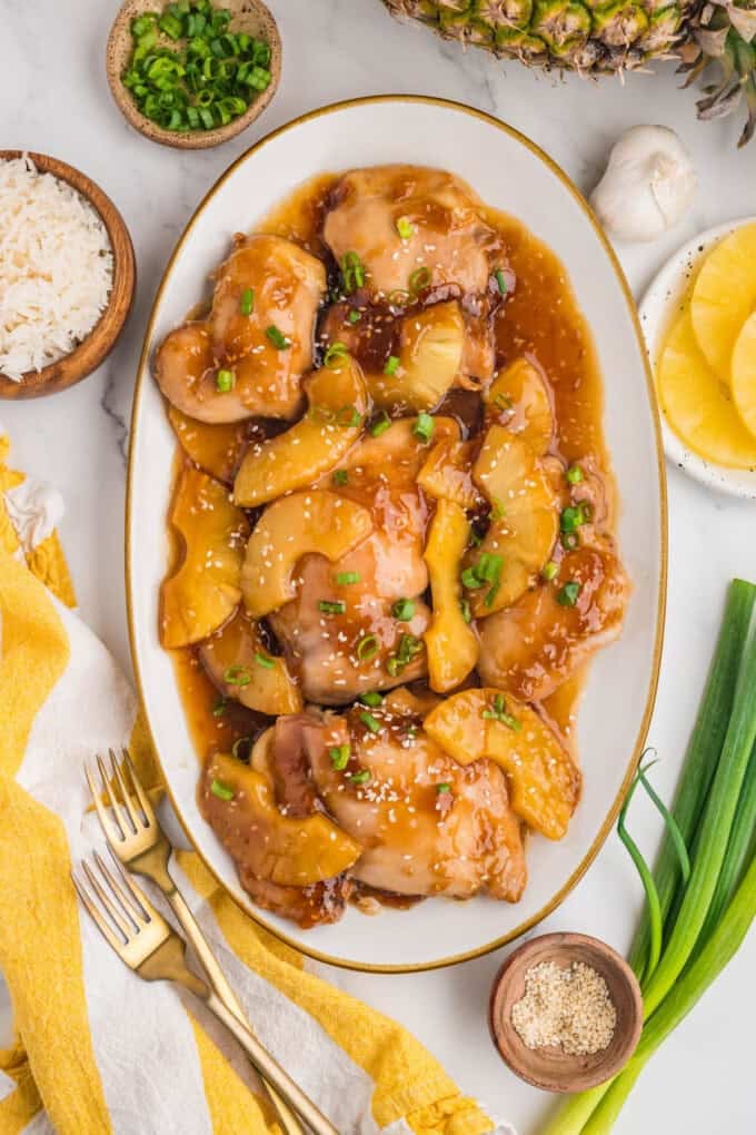 Baked pineapple teriyaki chicken on a large platter.