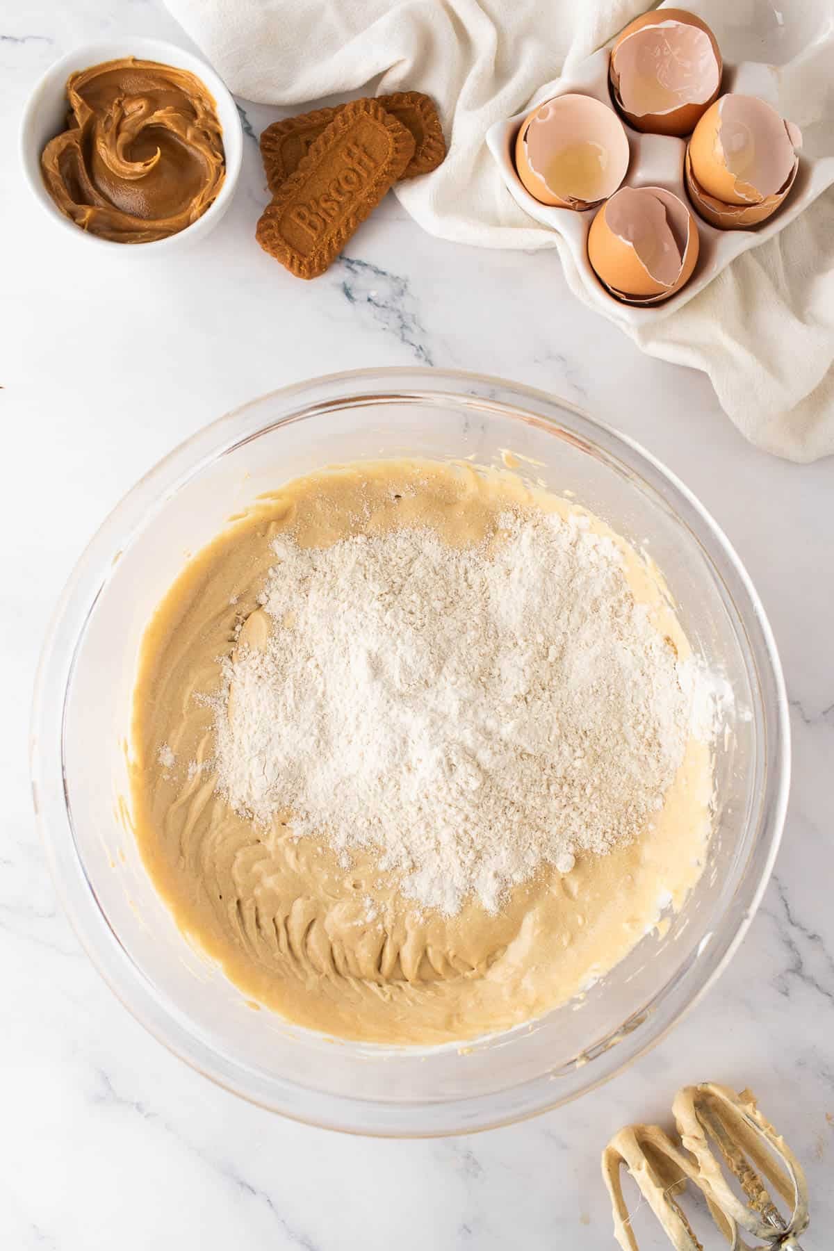 Adding dry ingredients to cake batter.