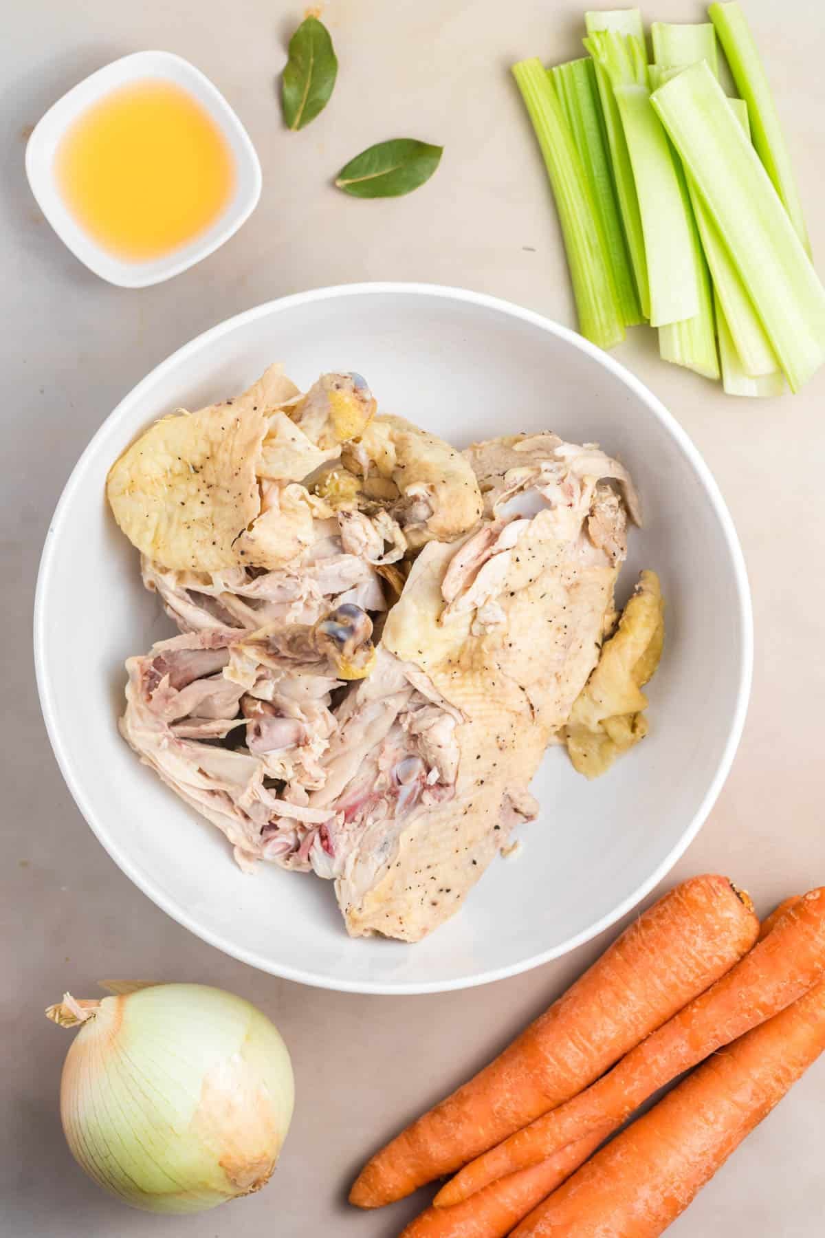 An overhead image of ingredients for making homemade chicken broth.