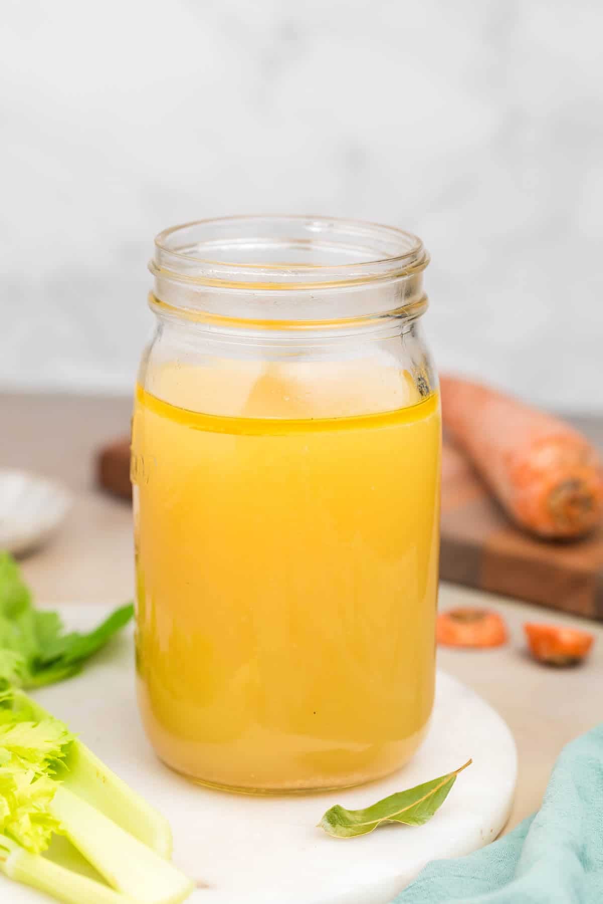 An image of a bottle of homemade chicken broth.