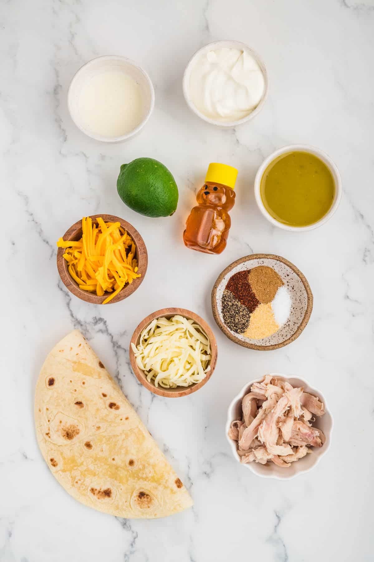 Ingredients for making honey lime chicken enchiladas.