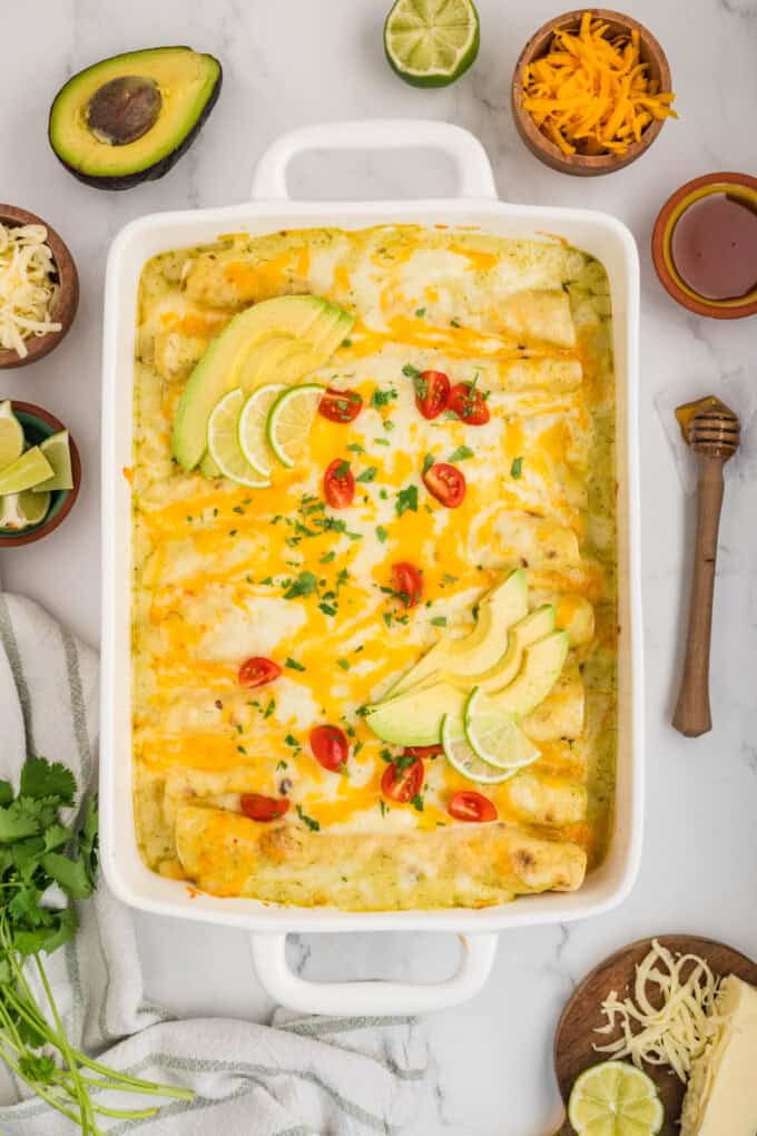 An overhead image of baked honey lime chicken enchiladas.
