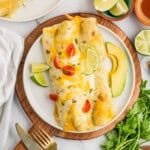 An overhead image of a plate of honey lime chicken enchiladas.