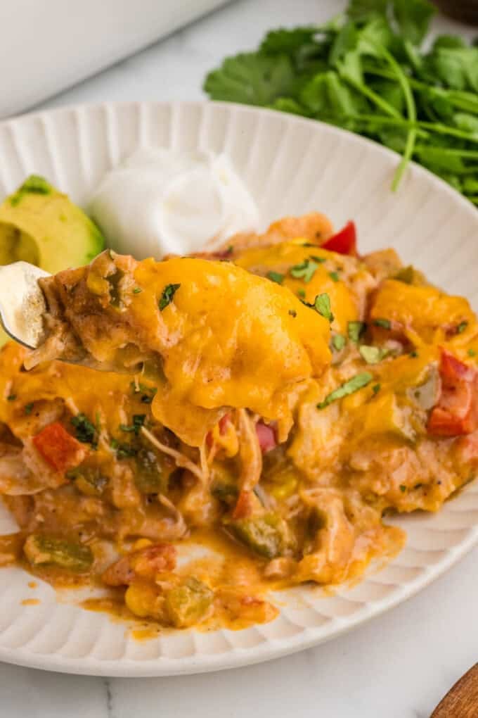 Plating a serving of king ranch chicken casserole.