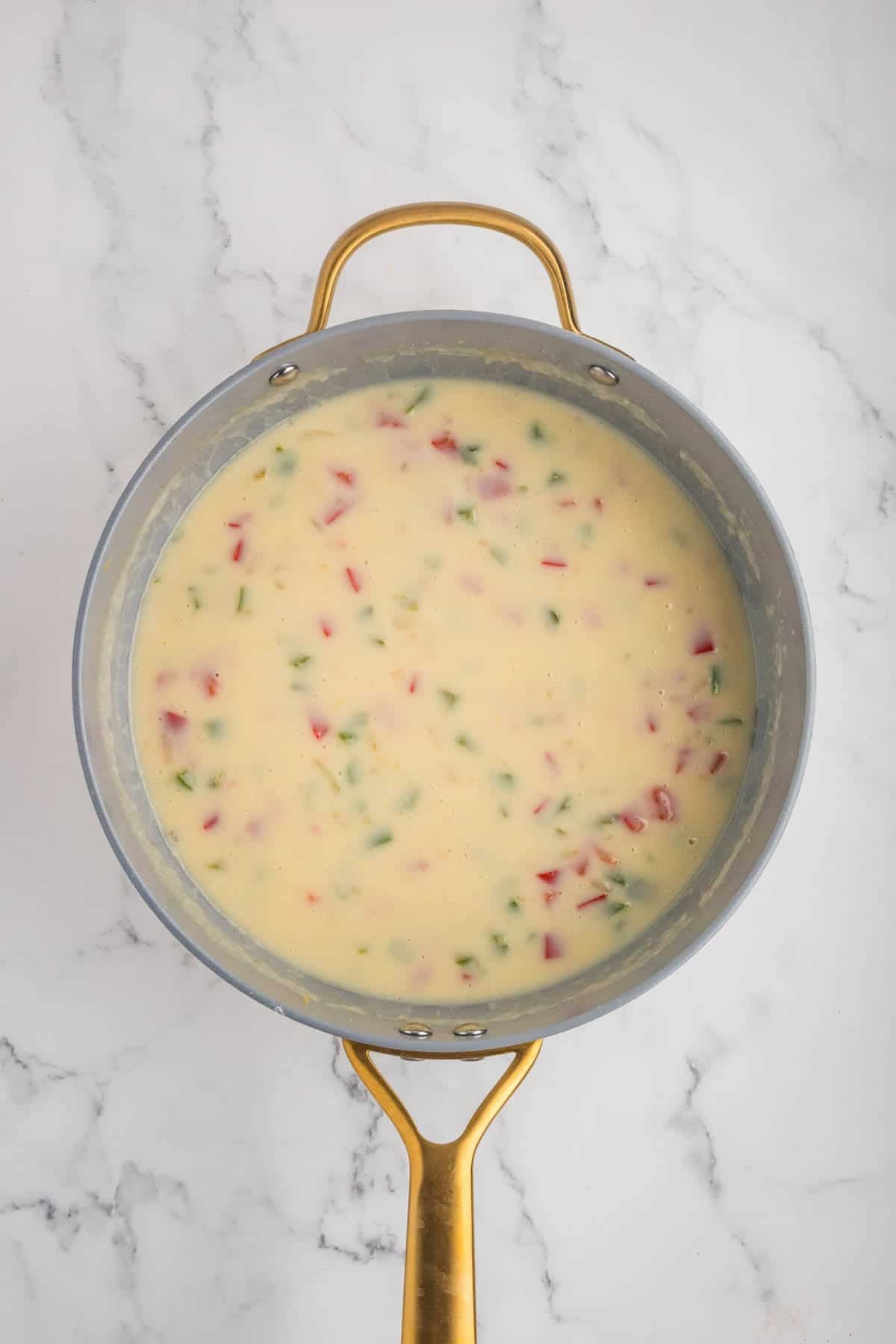 A creamy sauce in a skillet.