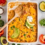 An overhead image of a pan of king ranch chicken with a wooden spoon in it.