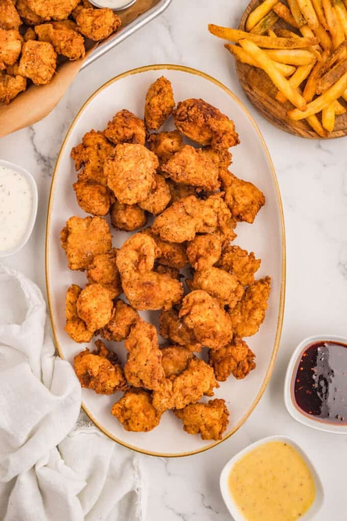An overhead image of a plate of popcorn chicken.