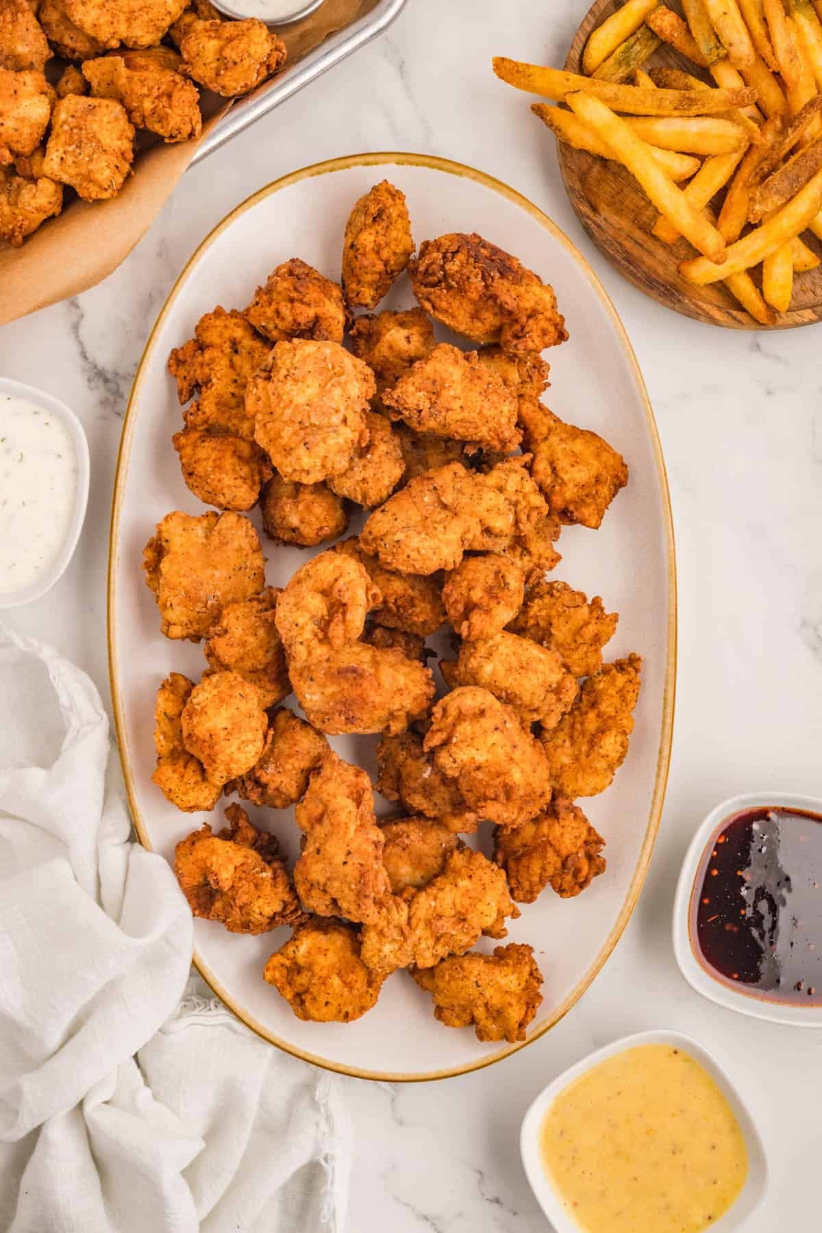 An overhead image of a plate of popcorn chicken.
