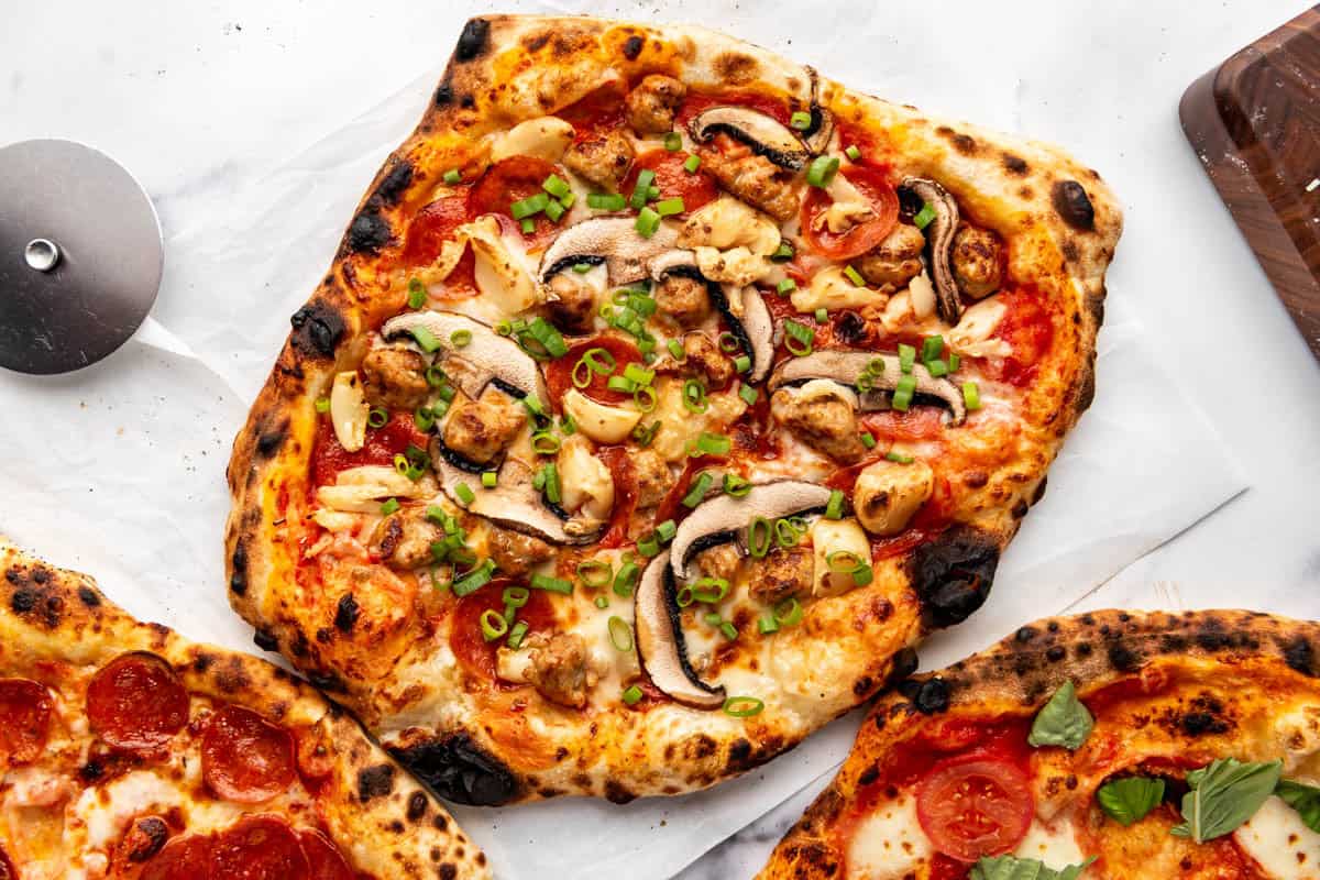 An overhead image of a copycat Pizza My Heart Big Sur pizza made with homemade sourdough pizza crust.
