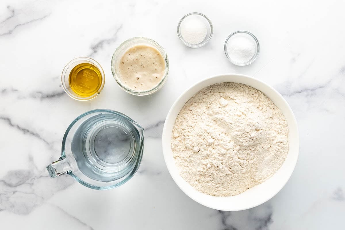 Ingredients for making sourdough pizza dough.